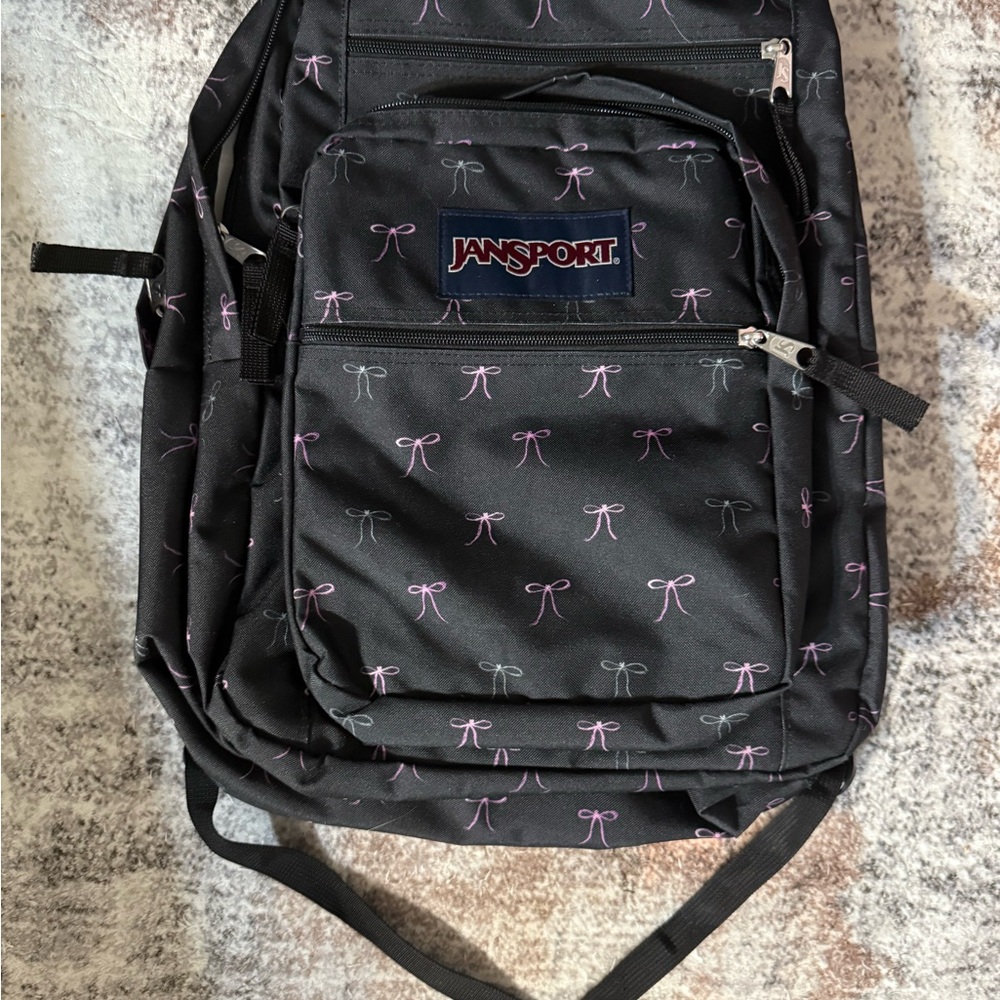 Jansport Black Backpack with Purple Bow Pattern